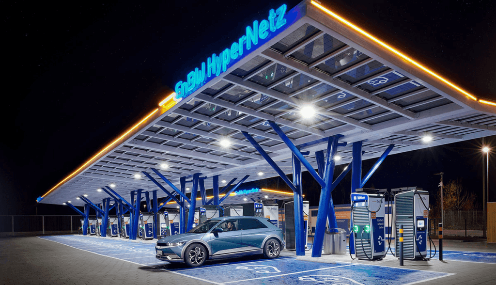 EV charging station with a car charging at night in Europe